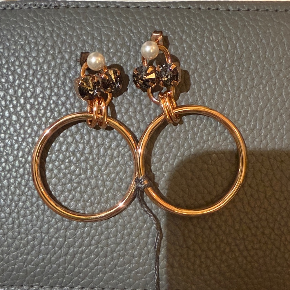 Barney’s Elegant Gold and Black Floral Hoop Earrings